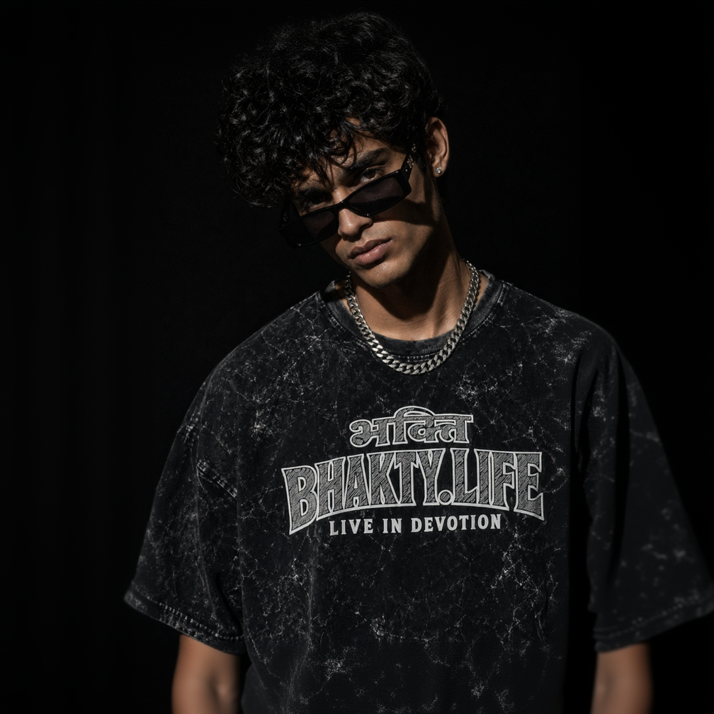 Person wearing a black t-shirt with 'Bhakti.Life' text on a dark background