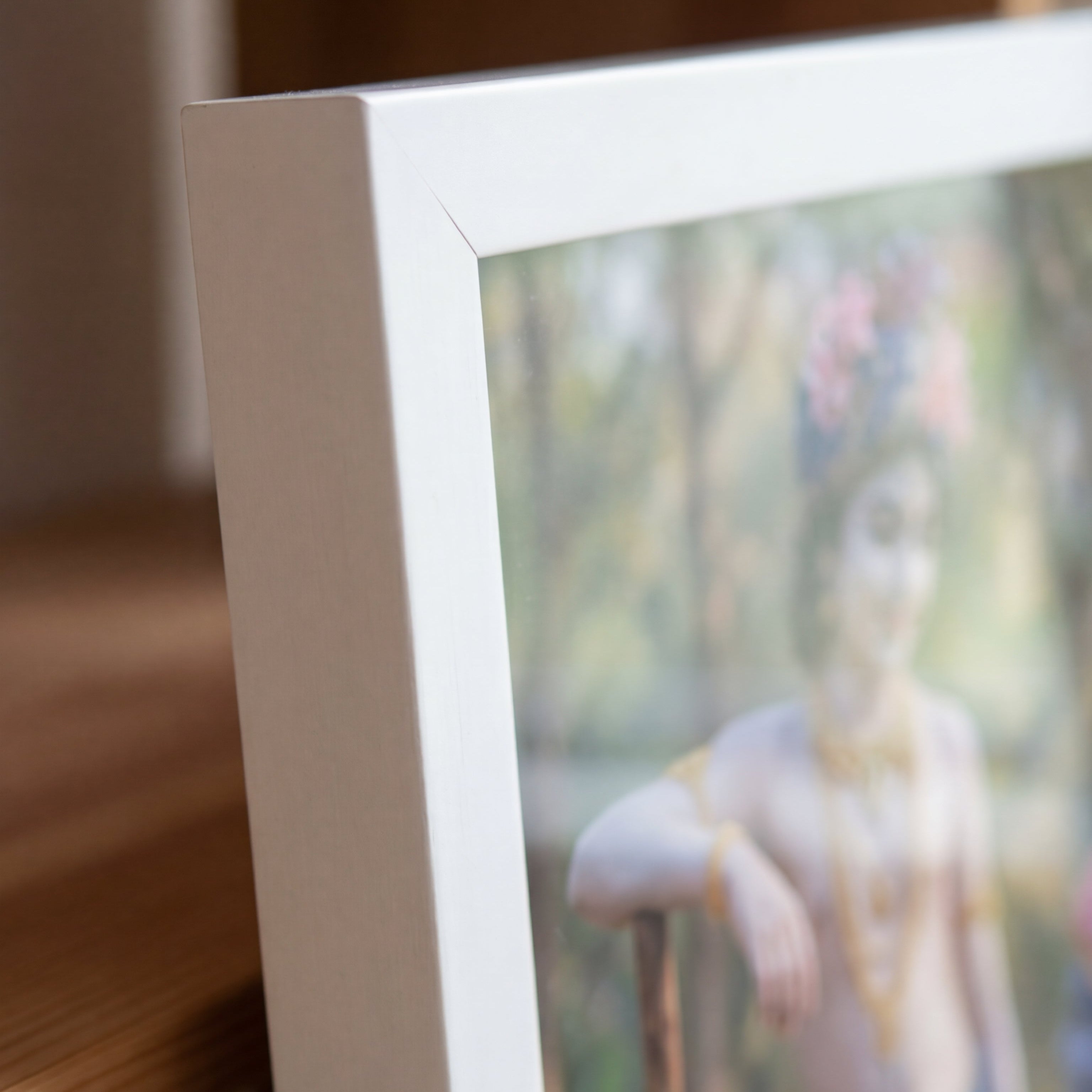 Close-up of a digital photo frame displaying a person with a cane outdoors.