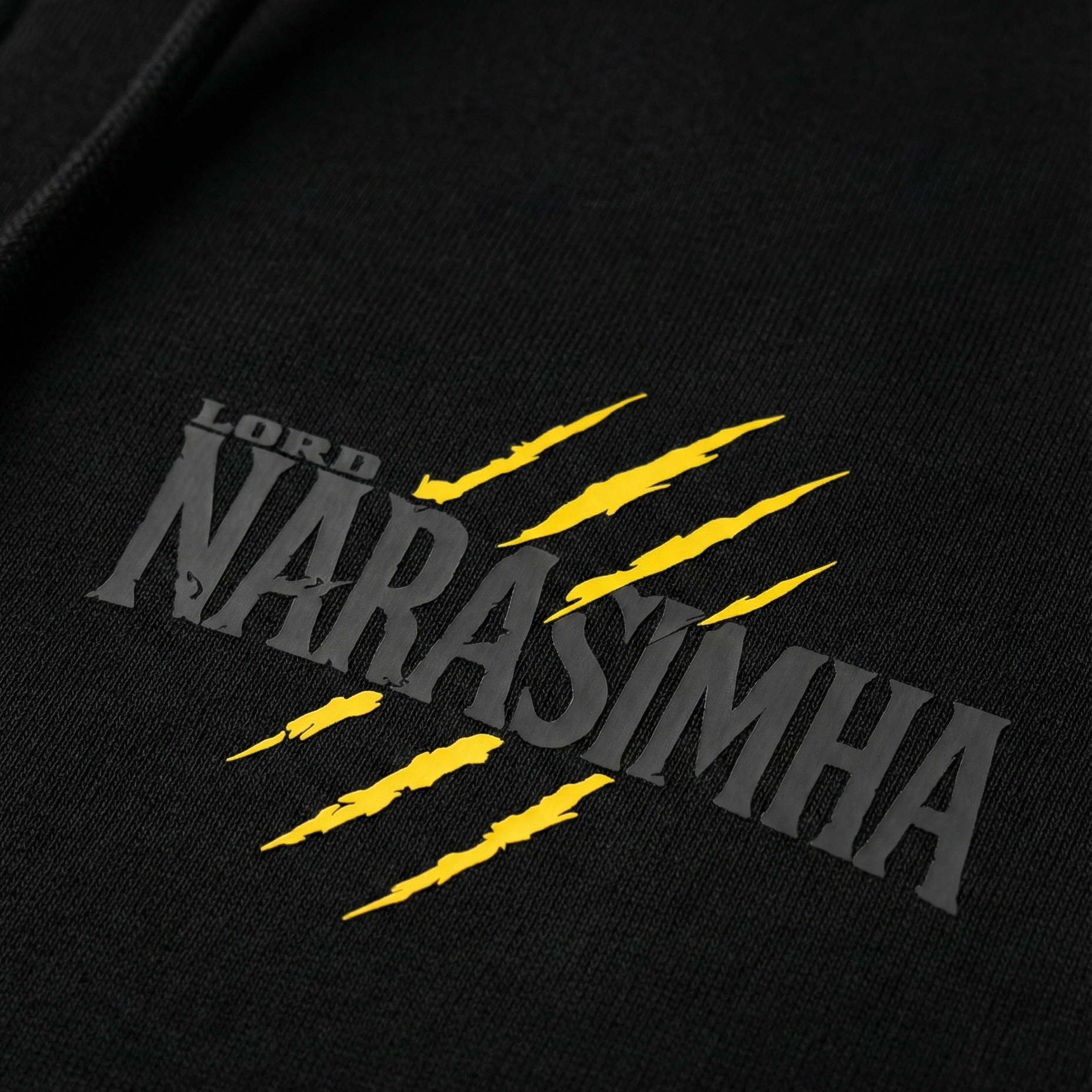 Black hoodie with 'Lord Narasimha' text and yellow claw marks on a dark background