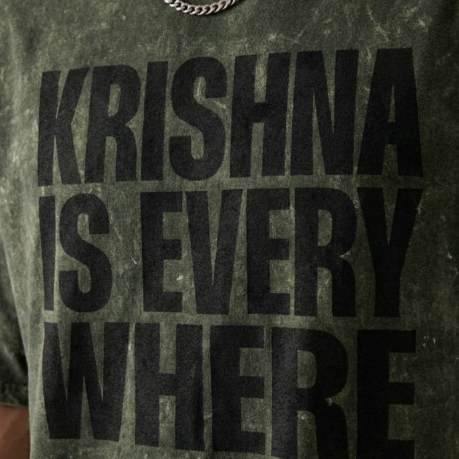 T-shirt with 'KRISHNA IS EVERYWHERE' text on a dark background